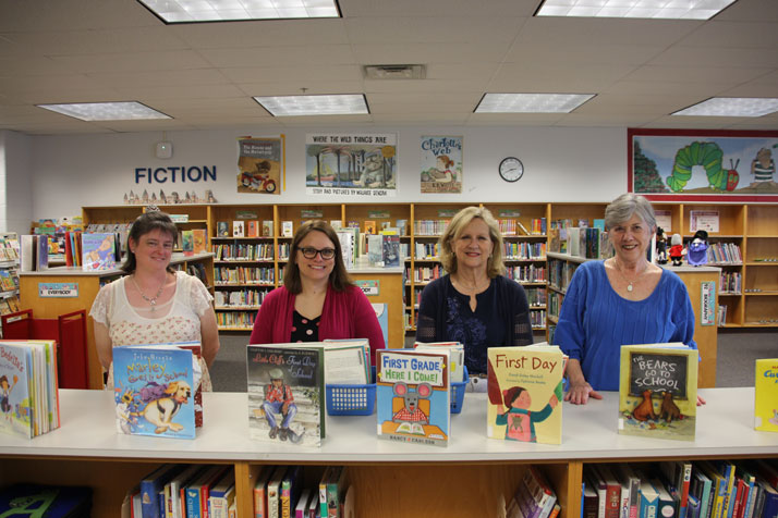 First grade teachers posing in the library